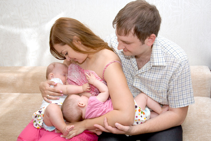 Breast feeding two little sisters twin girls at same time